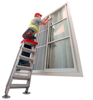 Technician installing impact-resistant window on residential property